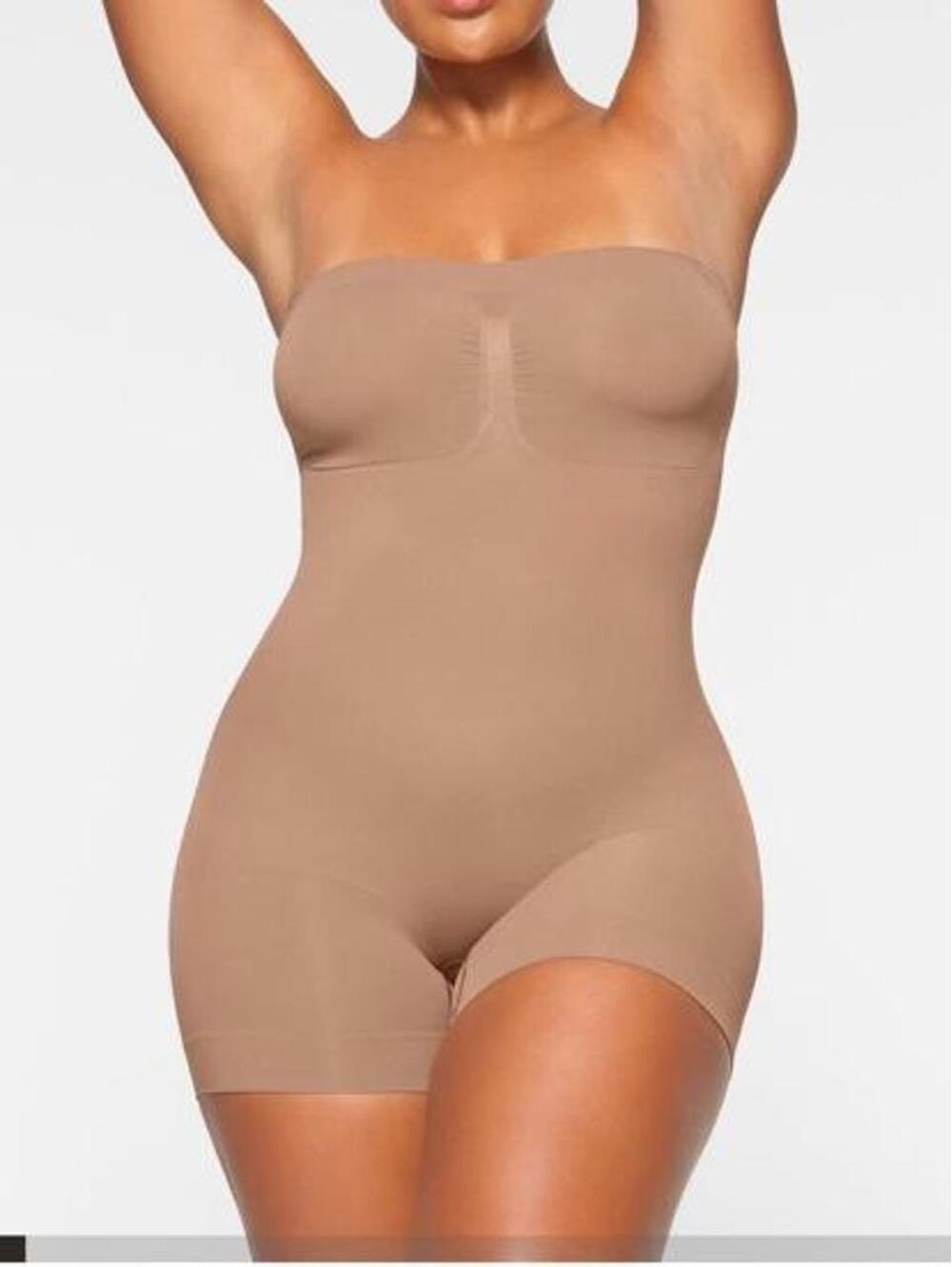 SKIMS Sheer Seamless Strapless Shortie Bodysuit in Sienna